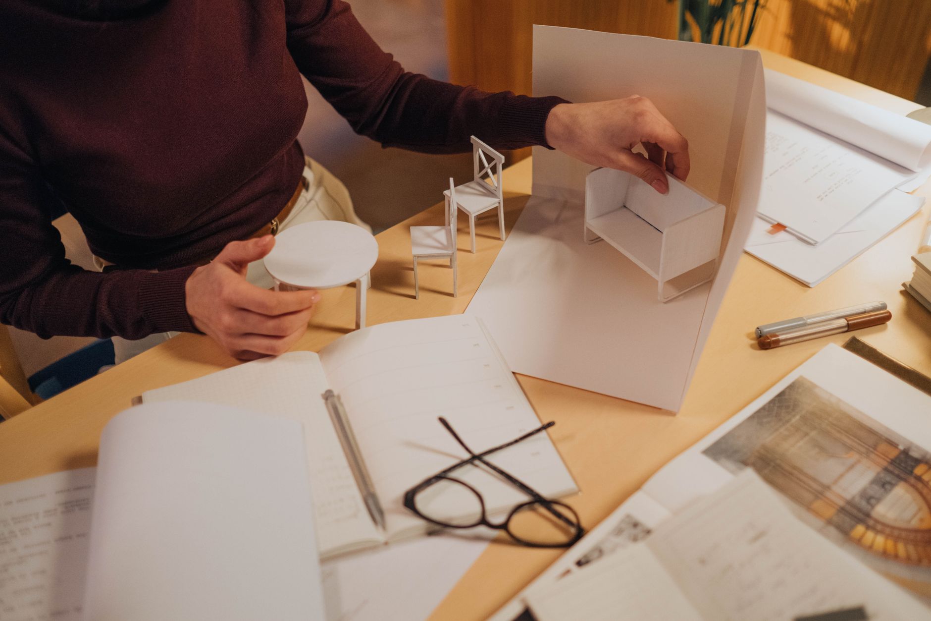 Architectural model and drawings on the studio table